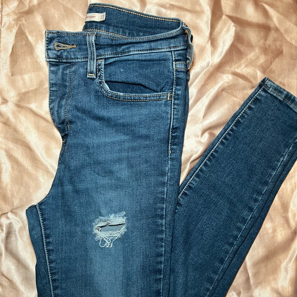 Levi’s high rise super skinny distressed jeans